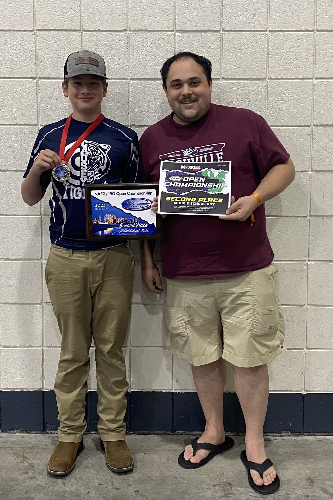 Brycen Conner and Coach Joshua Clarke with his 2023 second-place awards