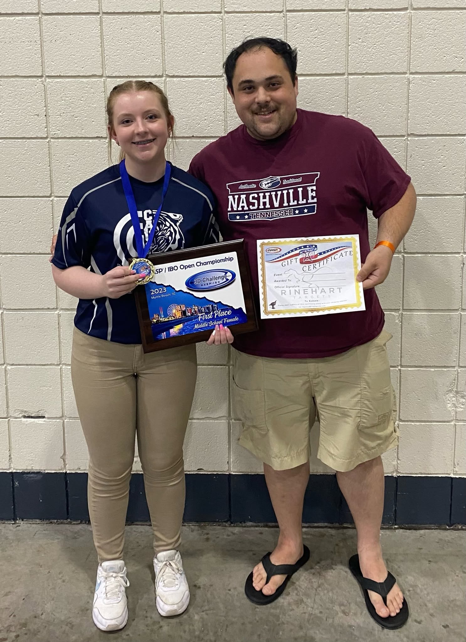 Kayley Miller and Coach Joshua Clarke with her 2023 NASP/IBO first-place award